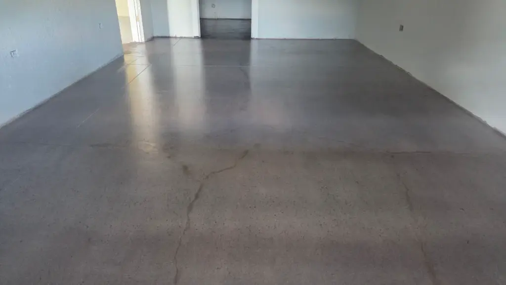 Brightly lit garage showcasing a finished epoxy floor