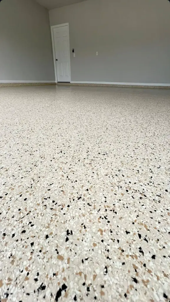 Close-up of a light-colored epoxy floor with speckles